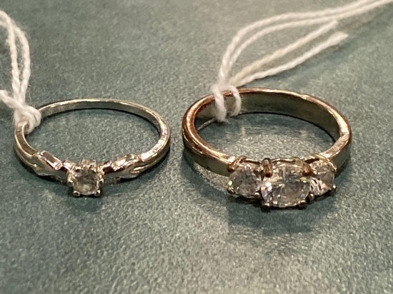 (2) Unmarked rings. Stones are not diamonds.