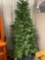 Mountain King 1/2 Christmas tree (it?s purposely half to fit in smaller spaces) against a wall