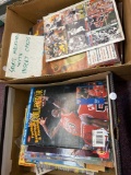 2 boxes full of sports magazines, and comics