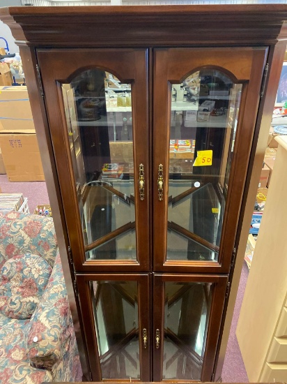 Cherry curio cabinet glass and lighted , great condition