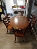 Tell city oak table with formica top, 2 extra leaves and 6 oak chairs
