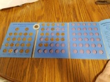 Partial book of pennies, lucky penny