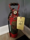 Painted copper fire extinguisher with wood handle