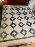 Handmade blue block quilt, shows fading