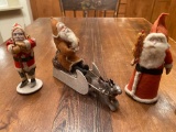 (3) Santa figurines.