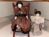 Two old china head dolls, doll chair.