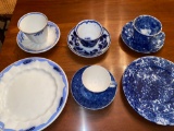 Old handless cups w/ saucers, plates.