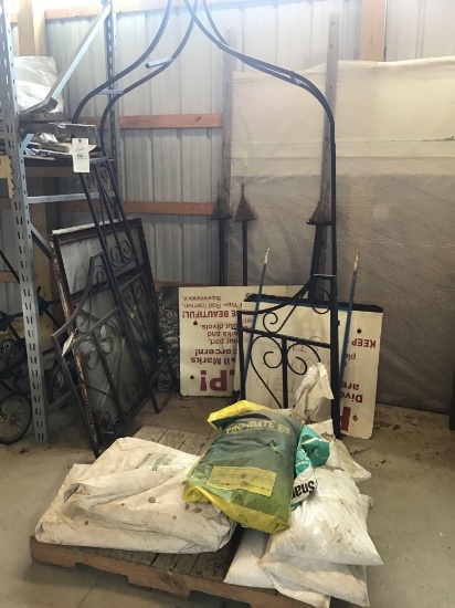 Signs and garden trellis. Assorted bags of fertilizer