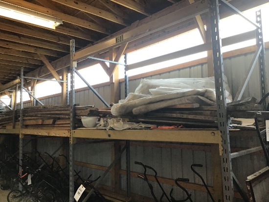 Assorted lumber on shelf.
