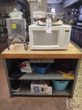 Metal stand w/ butcher block top, GE microwave and glass beverage dispenser