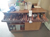 Wooden storage cabinet with assorted utensils, Vases and Christmas decor