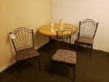 Metal framed table and 3 chairs with 2 candle holders