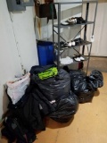 Assorted golf shoes and clothing, metal shelf