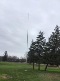 Large flag pole cemented in ground. Buyer responsible for removal