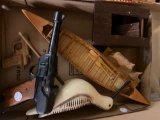 1 flat carved wood items , wrench, guns, birds, and more