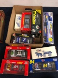 9 die cast vehicles, racing champions, NASCAR, horse and tanker bank, etc.