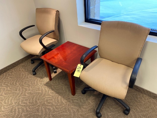 Pair of office chairs with coffee table