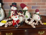 4 sitting snowmen & Santa