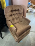 Brown swivel armchair