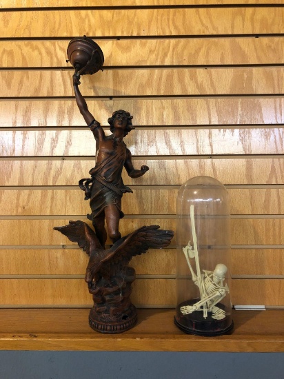 Plastic skeleton and art nouveau man astride eagle Newell post lamp