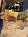 Vintage telephone parts and burlap sacks with advertising