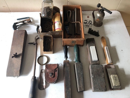 Ant. leather clamp - nails - ant. torch - iron - honing stones and sharpeners