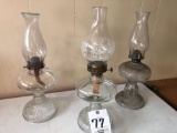 Three oil lamps