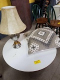 Round contemporary coffee table, lamp, large pillow