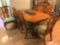 Very nice quality oak Carved dining table W/ 6 padded chairs And two extra leaves