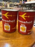 1 bucket and 2 oil cans with some oil in them