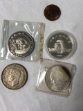 5 foreign coins, some silver
