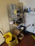 Wire shelf, mop bucket, stereo, and phone
