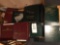 Assorted coin and stamp albums.