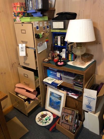 File cabinet, oil lamp, wooden shelf, and assorted desk items.