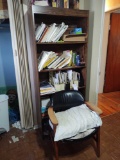 Bookcase with contents and chair
