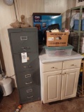 Four-drawer filing cabinet and cabinet with contents