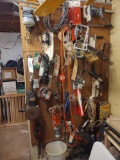 Contents of Peg Board: grinder, paint sprayer, pipe wrenches, C clamps, hand tools & Model Airplane