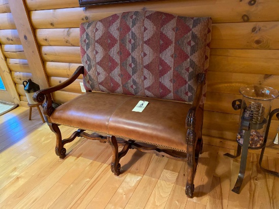 Southwestern Settee with leather bench seat and print pattern back.