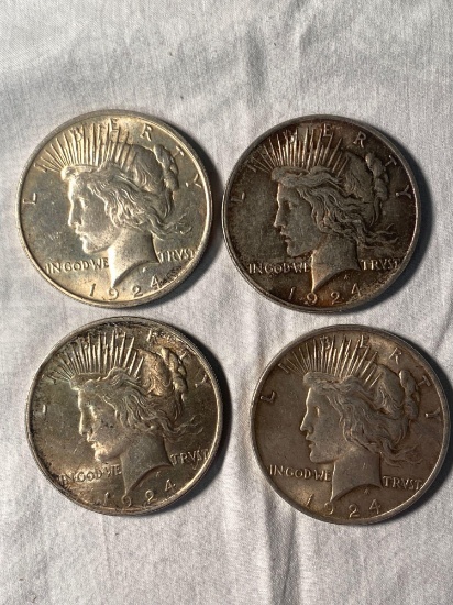 (4) 1924 Peace silver dollars. Bid times four.