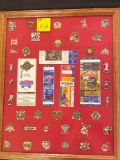 Frame w/ (37) metal Indians/Aeros/Bisons metal collector pins, '95 World Series tickets, '97 ticket