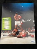 Muhammad Ali signed 8 x 10 photo. In the Zone Authentics COA sticker.
