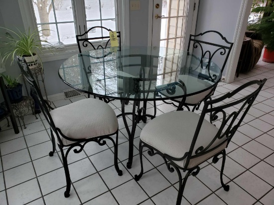 Heavy Wrought Iron glass-top kitchen table with four chairs