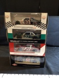 4 Assorted 1:24 Die cast Stock Cars