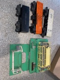 (3) Lionel train cars and Lionel 3656 stockyard