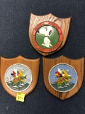 3 metal painted award plaques on wood