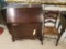 Mahogany slant-front desk with key and ladder-back chair