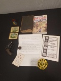 Boy Scout handbook, starter pistol, small Washington prints