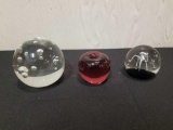 3 paperweights signed