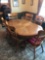 Nice oak stretcher claw food base table with 6 chairs and extra leaf