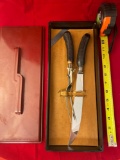 Remington carving knife & fork, sterling band, with bakelite type case. Case has crack.